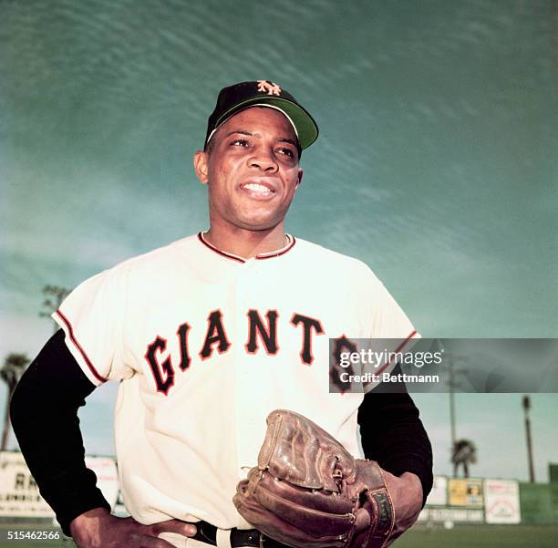 Willie Mays of the New York Giants. Waist-up photograph with hands on his hips.