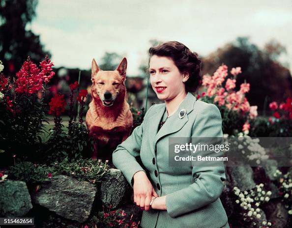 Queen Elizabeth in Garden with Dog