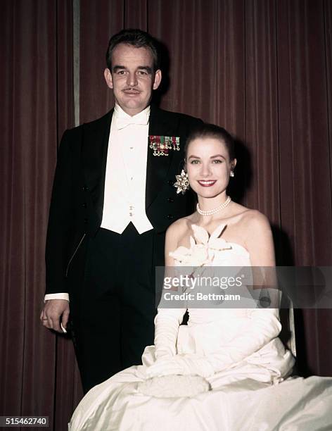 Grace Kelly, American actress who left Hollywood to marry Prince Rainier of Monaco. They are together here at the Monte Carlo Ball.