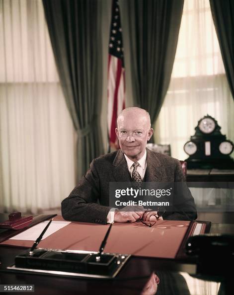 President Eisenhower Sitting at Desk in Oval Office