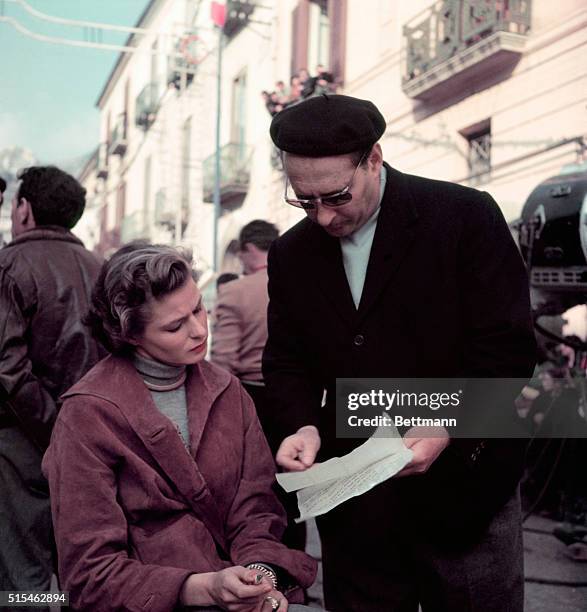 Ingrid Bergman and husband director Roberto Rossellini go over script before shooting the next scene in their latest film New Wine, which also...