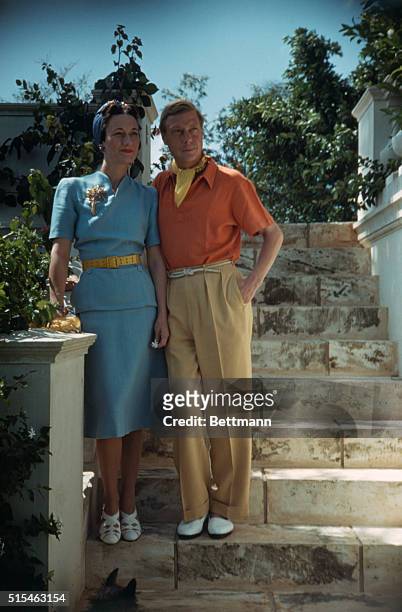 The Duke and Duchess of Windsor standing on stone steps.