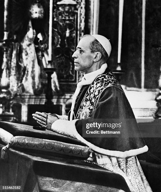 This scene, showing Pope Pius XII kneeling in prayer, is from a special television film, made for showing in connection with the 1950 Holy Year...