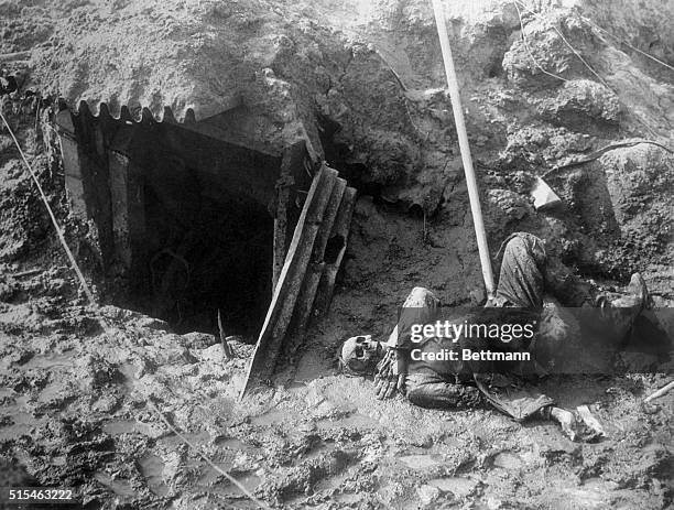 Breaking through the Hindenburg line in the Argonne, the Yanks found this abandoned trench and dugout with a lone skeleton staring at the sky from...