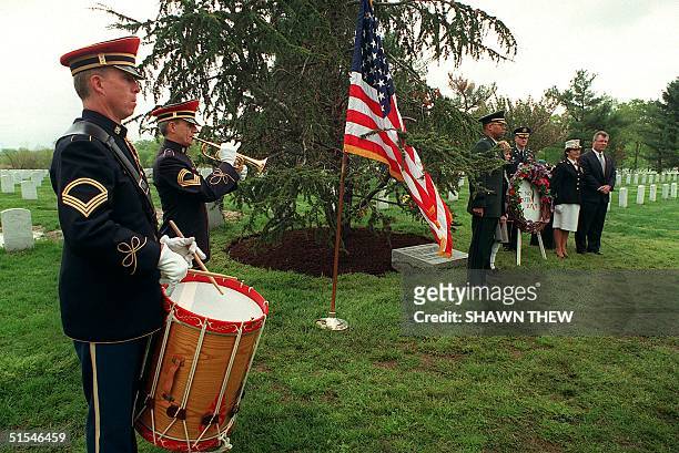 Army bugler prepares to sound "Taps" as L-R at the right of the photo Brigadier Gen. Michael Rochelle, Carmella LaSpada, No Greater Love Founder,...
