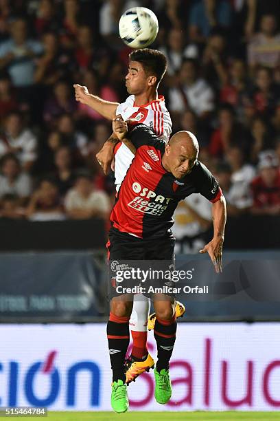 Gonzalo Martinez of River Plate and Clemente Rodriguez of Colon jump for a header during a match between Colon and River Plate as part of Torneo de...