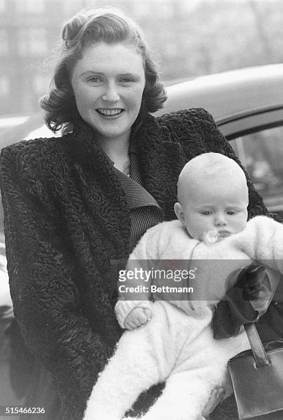 Winston Junior Visits His Grandpa. Keystone photo shows: Heir to a great name, Master Winston Churchill is carried by his mother, Mrs. Randolph...
