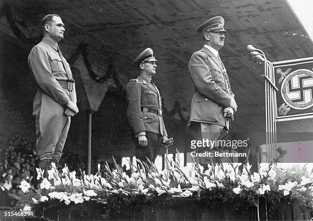 Nuremberg, Germany: Rudolf Hess, high-ranking Nazi, with Hitler and Von Schirach on the podium of the stadium of Nuremberg. Ca. 1930s.