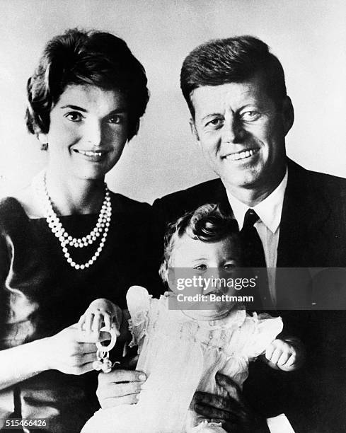 President John F. Kennedy with his wife, Jackie, and their daughter, Caroline.