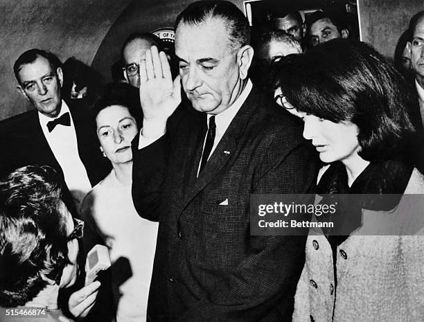 Lyndon B. Johnson, during his inauguration immediately after John F. Kennedy's assassination, with Jackie Kennedy by his side.