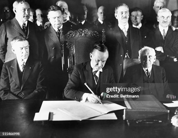 President Calvin Coolidge Signing Kellogg Peace Pact with Observers