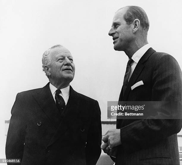 Ottawa: The Duke of Edinburgh chats with Governor General Roland Michener prior to his departure by plane to Kingston, Ontario. Prince Philip is in...