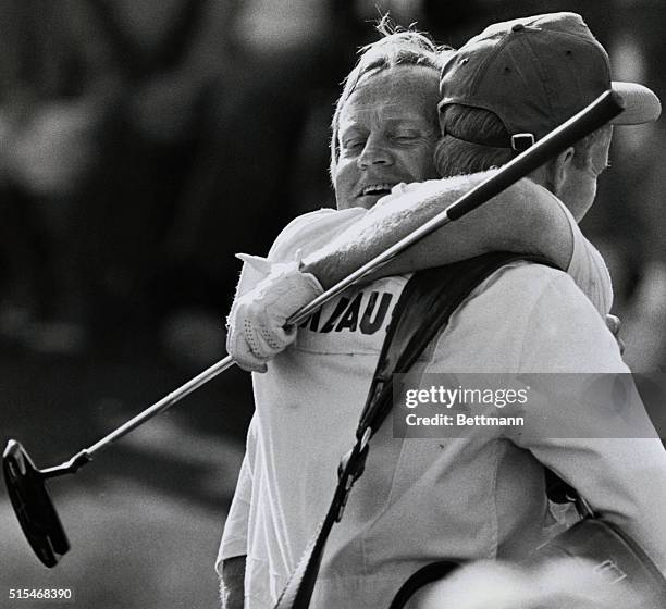 Augusta: Jack Nicklaus is hugged by his son, Jack, Jr., who is also his caddy, after Nicklaus finished his final round of the Masters, April 13th....