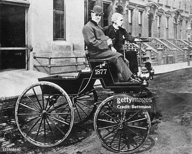 Photomontage showing American inventor George B. Selden at the wheel of his 'Road Engine' with industrialist Henry Ford in the passenger seat. The...