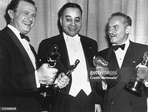 Joseph Mankiewicz, Dr. Ralph Bunche, and Darryl Zanuck. Bunche presented award for the best picture award to Mankiewicz. Zanuck received that...
