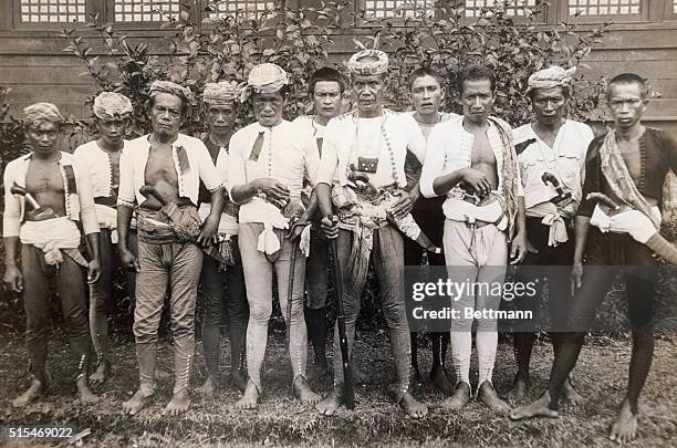 Iman Ibbah And His Moro Followers. A typical group of Mohammed Moros of the Southern Philippine Islands, who frequently find themselves in conflict...