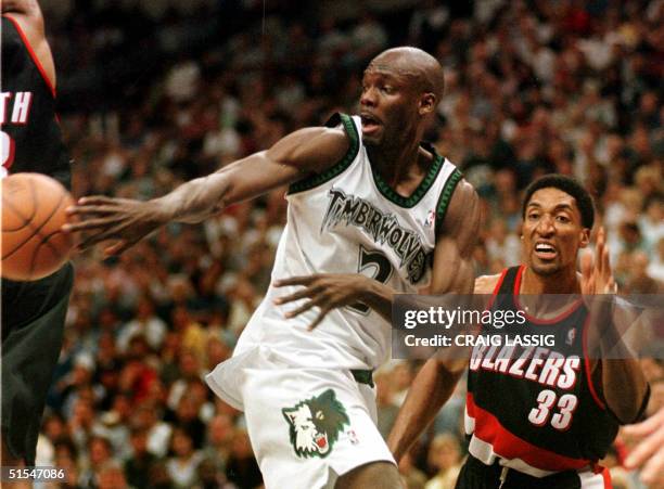 The Minnesota Timberwolves' Malik Sealy makes a pass as he drives past the Portland Trail Blazers' Scottie Pippen in the fourth quarter at the Target...