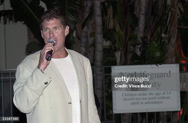 Actor David Hasselhoff introduces guests near a pool area during the Baywatch 10th Anniversary celebration 02 May, 2000 in Santa Monica, CA....