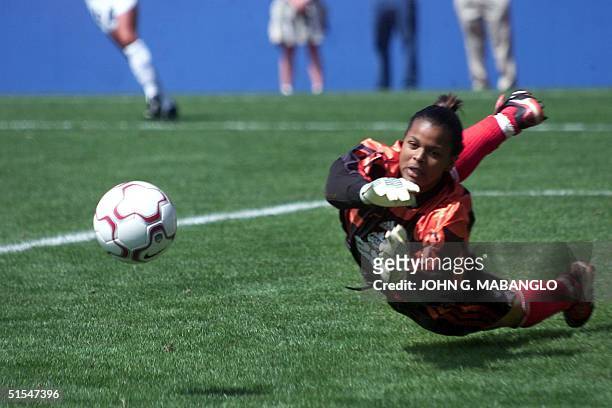Canada's goalkeeper Karina LeBanc blocks a shot on goal against the US offense during the championship final of the Women's Gold Cup 2000 07 May 2000...