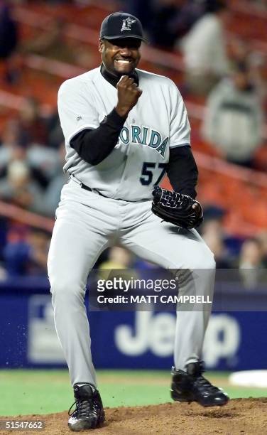 Florida Marlins' relief pitcher Antonio Alfonseco reacts to the final out of the game after striking out the side in the bottom of the ninth against...