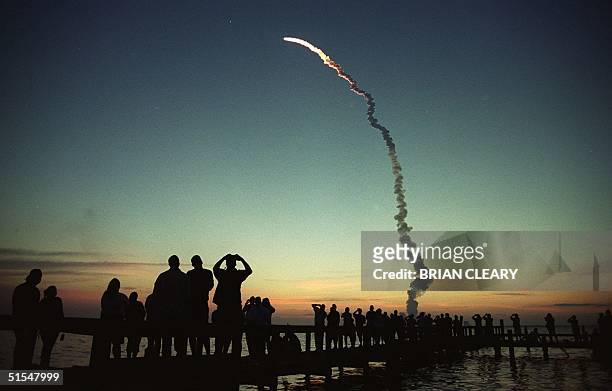 Space shuttle Atlantis climbs to orbit 19 May 2000 from launch pad 39-A at Kennedy Space Center, Florida to begin her ten-day mission to the...