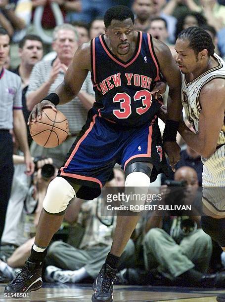 Patrick Ewing of the New York Knicks is guarded by Sam Perkins of the Indiana Pacers 31 May, 2000 during the first half of game five of the NBA...
