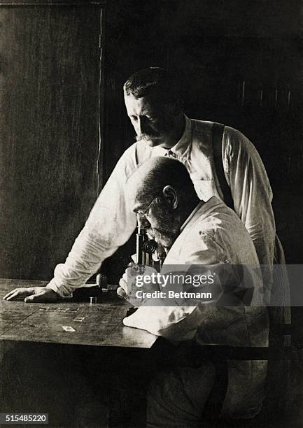 Robert Koch, 1843-1910, the founder of bacteriology and discoverer of the Cholera and tubercular bacillus, in his study with his oldest student and...