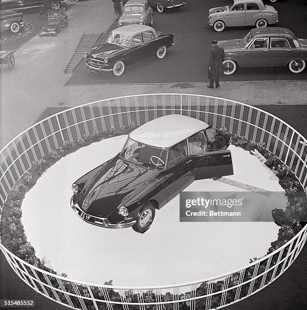 An unusual display sets off the new Citroen DS-19 at the 15th International Auto Exhibit in Copenhagen, Denmark. The French auto, which features...