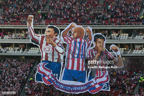 Fans of Chivas cheer for their team before the 10th round match between Chivas and America as part of the Clausura 2016 Liga MX at Chivas Stadium on...