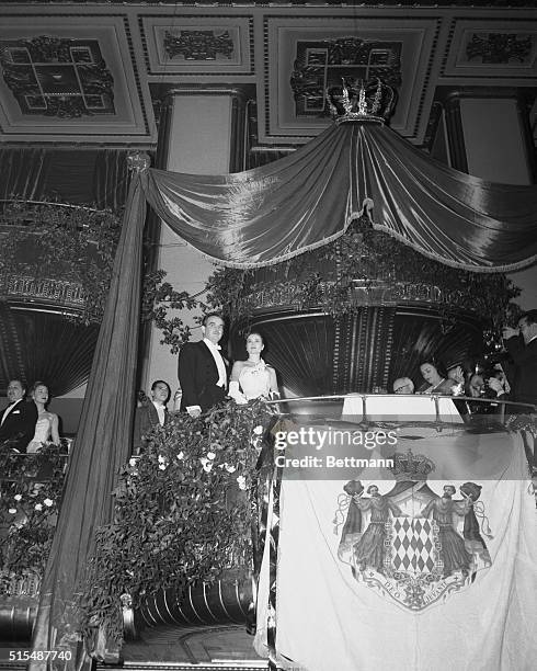 Prince Ranier III of Monaco and his Princess-to-be, Actress Grace Kelly, make third first public appearance at a fabulous high society ball...