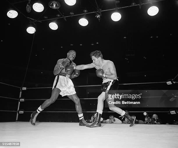 Robert Andrade, Compton, CA, lands a right to the head of Jimmy Carter, New York, former lightweight champion, during the 6th round of their nontitle...