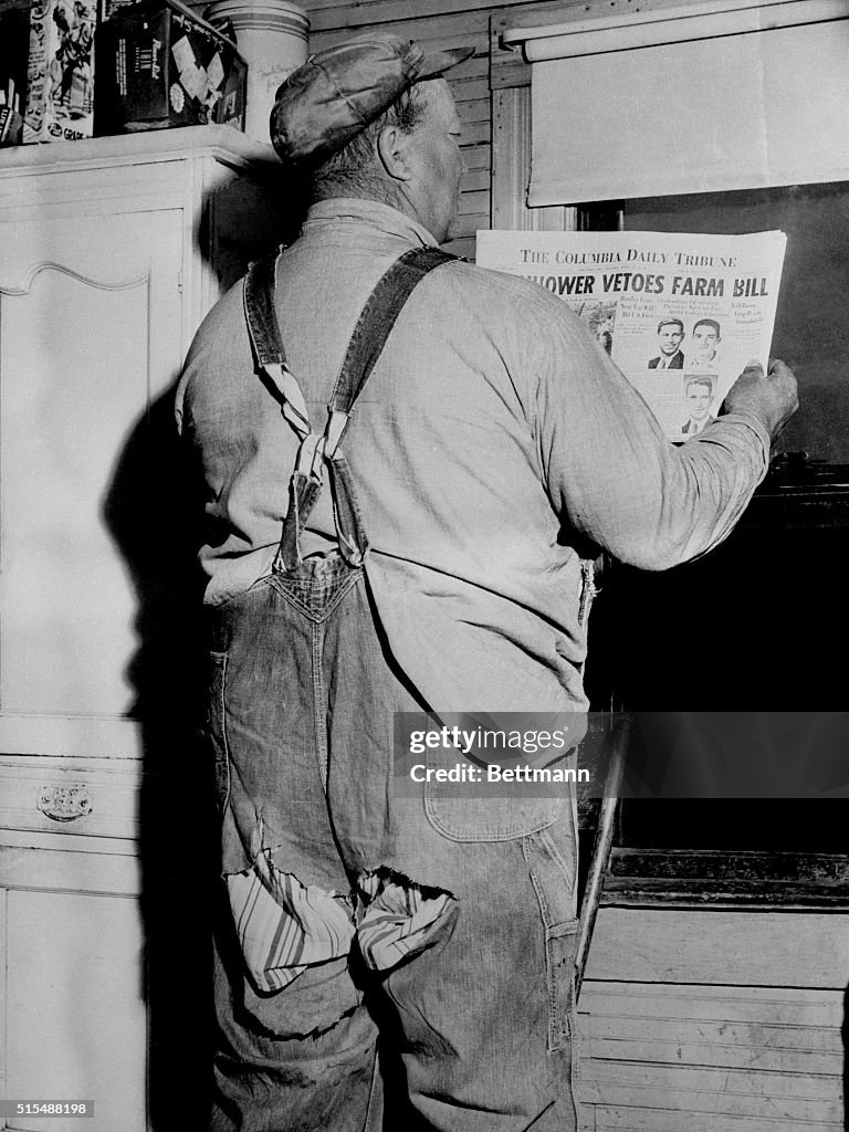 Farmer J.F. Wyatt Reading the Newspaper