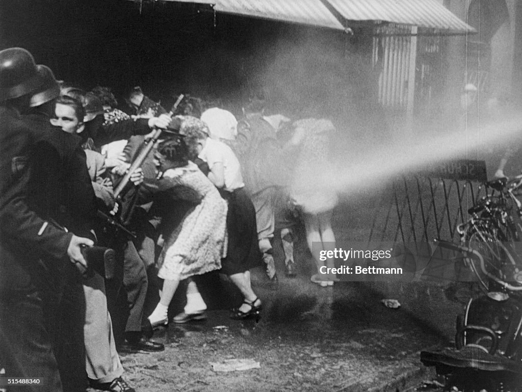 Police with Clubs and Firehoses Quelling Rioters
