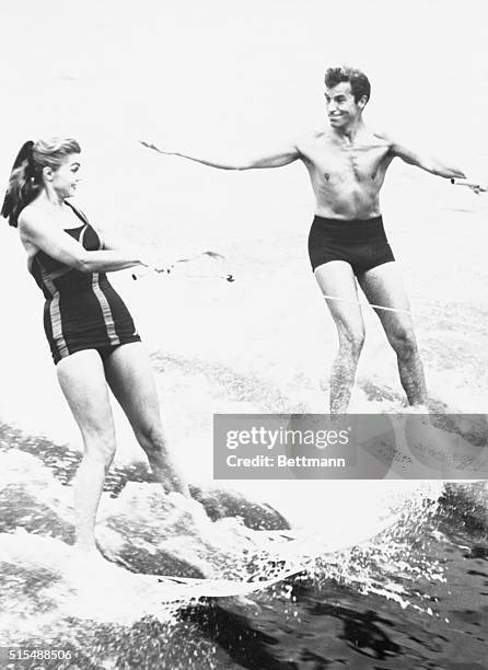 Cypress Gardens, Florida: "Look, Esther - one hand," calls Fernando Lamas to Esther Williams about his first time out water-skiing. The pair are at...