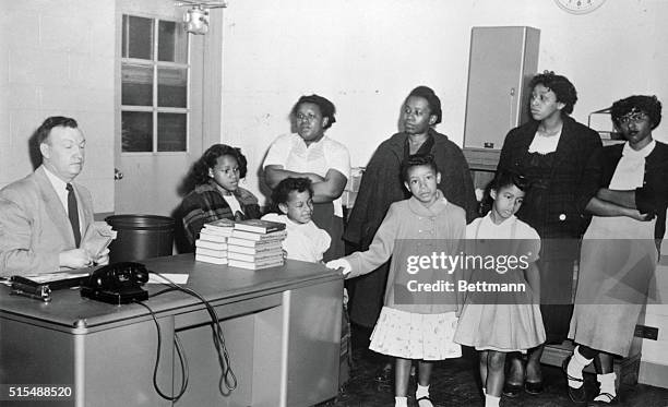 Four Negro mothers accompanied by a group of Negro children to Webster Elementary School, April 3rd, to hear Harold Henry, , Principal, once more...