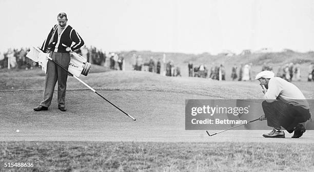 Arnold Palmer studies ball before putting attempt during British Open Golf Championship tourney play here 7/7. Australia's Kel Nagle won the...