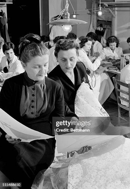 The Fontana sisters, Zoe and Micol look at some of the lace that will be used to make Margaret Truman's wedding dress. The Rome fashion house will...