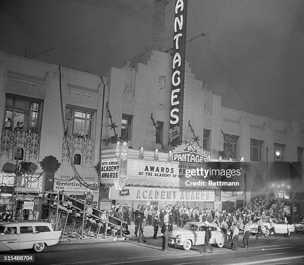 Crowds mill outside the Pantages Theater here, 3/21, as Press and police officials await the first arrivals for the 28th annual Academy Award...