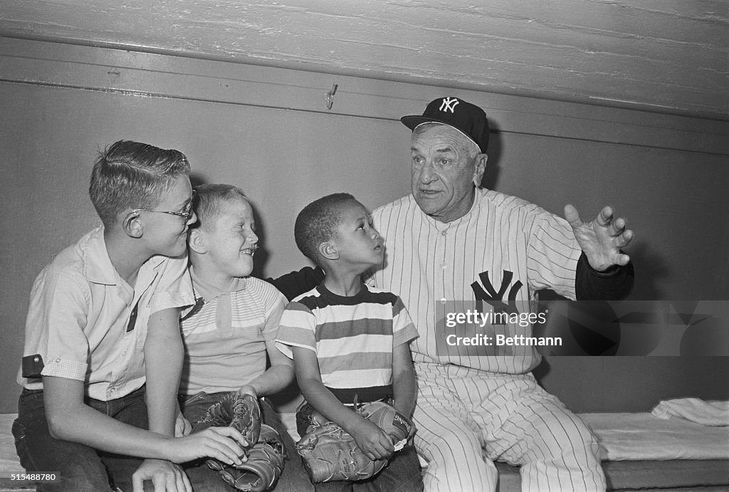 Yankee Manager Talking with Baseball Great's Children