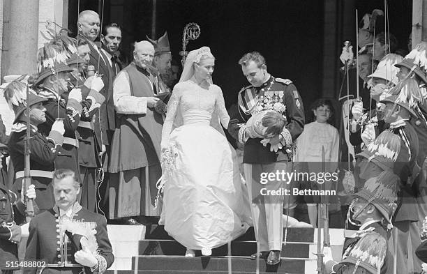 Hearts everywhere were thrilled by the dream like romance of Hollywood actress Grace Kelly and Prince Rainier of Monaco, shown here waving to the...