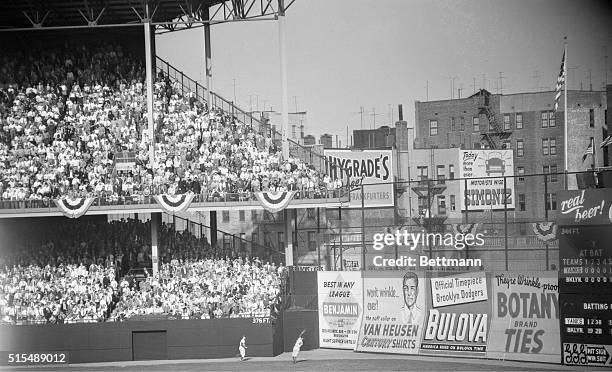 Back-hand catch for another out. Ebbets Field, Brooklyn: Brooklyn's Carl Furillo makes a leaping backhand catch of Billy Martin's long fly in the...