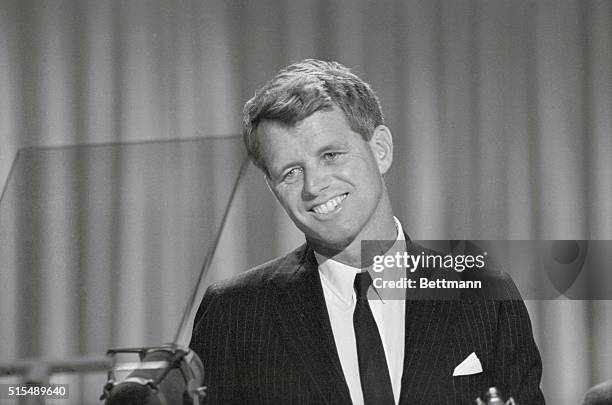 Attorney General Robert Kennedy, smiling but with tears in his eyes, receives the tremendous ovation of the Democratic National Convention.