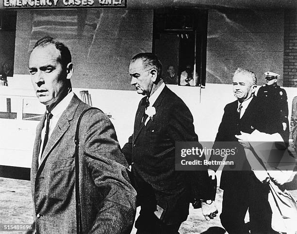 President Lyndon Johnson, his Secret Service Agent, Rufus Youngblood, and former Rep. Homer Thornberry, leave Parkland Memorial Hospital after John...