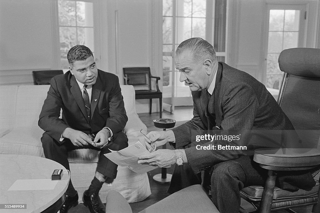 President Johnson Sitting with Whitney Young