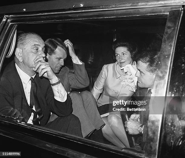 President Lyndon B. Johnson and Democratic Senatorial candidate Robert Francis Kennedy ponder over a puzzling point as they sit in the President's...