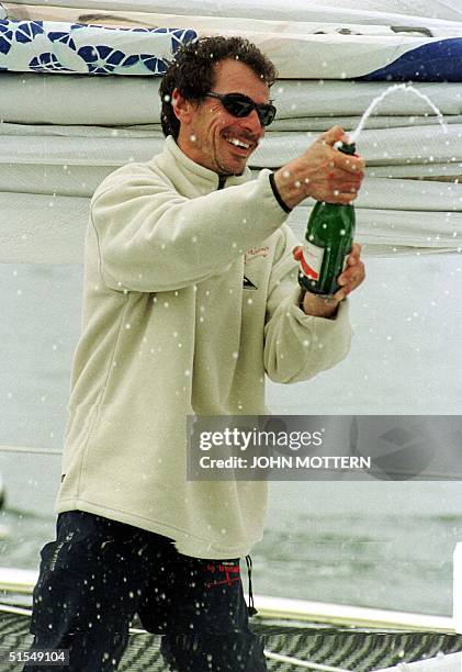 French sailor Marc Guillemot celebrates after placing second in the transatlantic Europe1 New Star solo race on his trimaran Biscuits La Trinitaine...