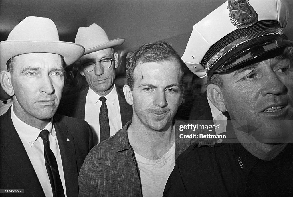 Lee Harvey Oswald Being Led by Policemen