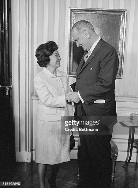 President Johnson greets Representative-elect Patsy T. Mink of Hawaii, at a White House Reception for freshmen Congressmen tonight. Mrs. Mink, a...