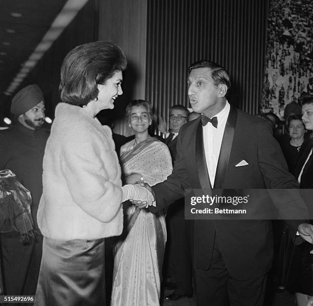 Mrs. Jacqueline Kennedy is greeted by Consul General of India S.K. Roy on her arrival at the Union Carbide Building to view an exhibition of the life...