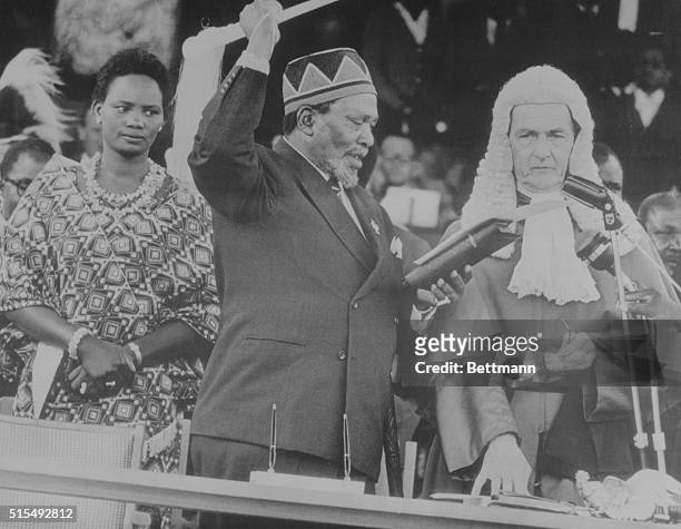 Sworn in as Kenya's Leader. Nairobi, Kenya: Jomo Kenyatta is sworn in as the Republic of Kenya's first president as his young Kikuyu wife, Njina ,...